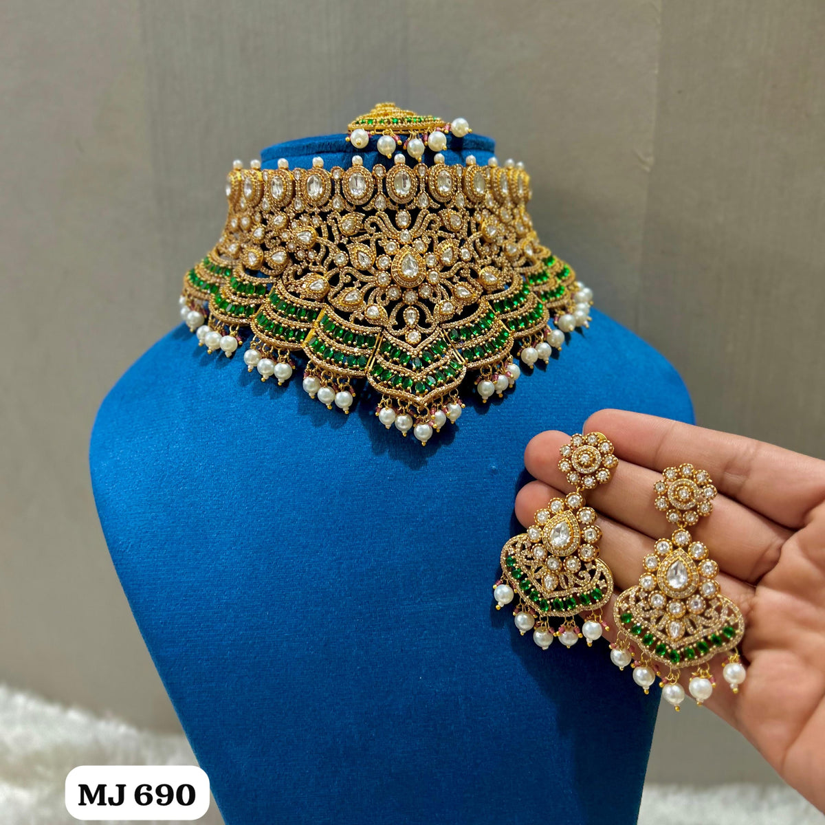 the Zevar Kundan & Pearl Choker Necklace Set Emerald Green Royal Kundan Emerald Ruby Pearl Bridal Choker Necklace Set with Earrings and Maang Tikka