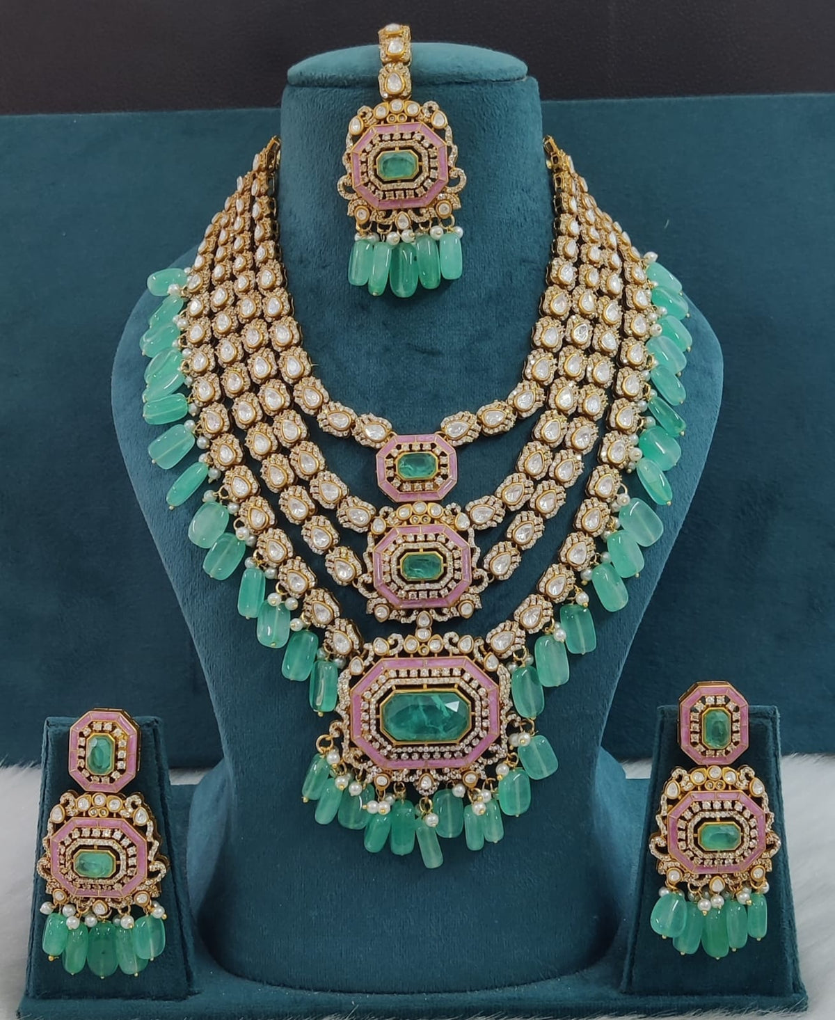 the Zevar Pulki with layered Necklace Set Mint Green Multi-Layered Multicolor Beads Kundan Polki Necklace with Maang Tikka & Earrings