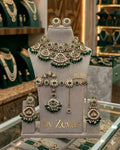 the Zevar Semi Bridal Jewelry Set Antique Finish Faux Semi Bridal Jewelry Set with Scalloped Motifs & Emerald Drops