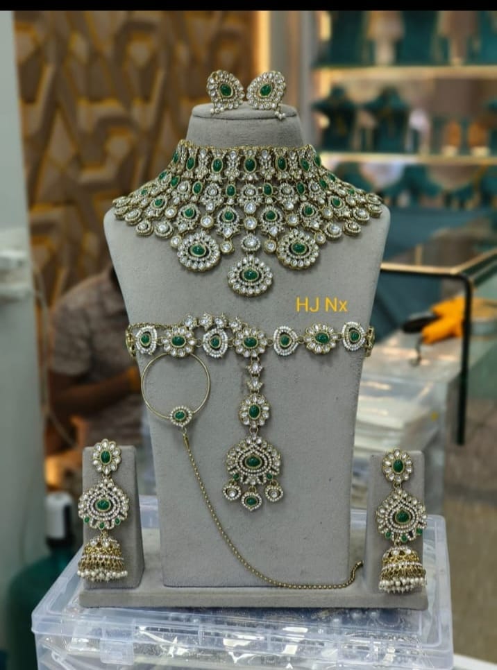 the Zevar Semi-Bridal Jewelry Set Semi Bridal Jewelry Set with Emerald Green Stones, Matha Patti & Nath