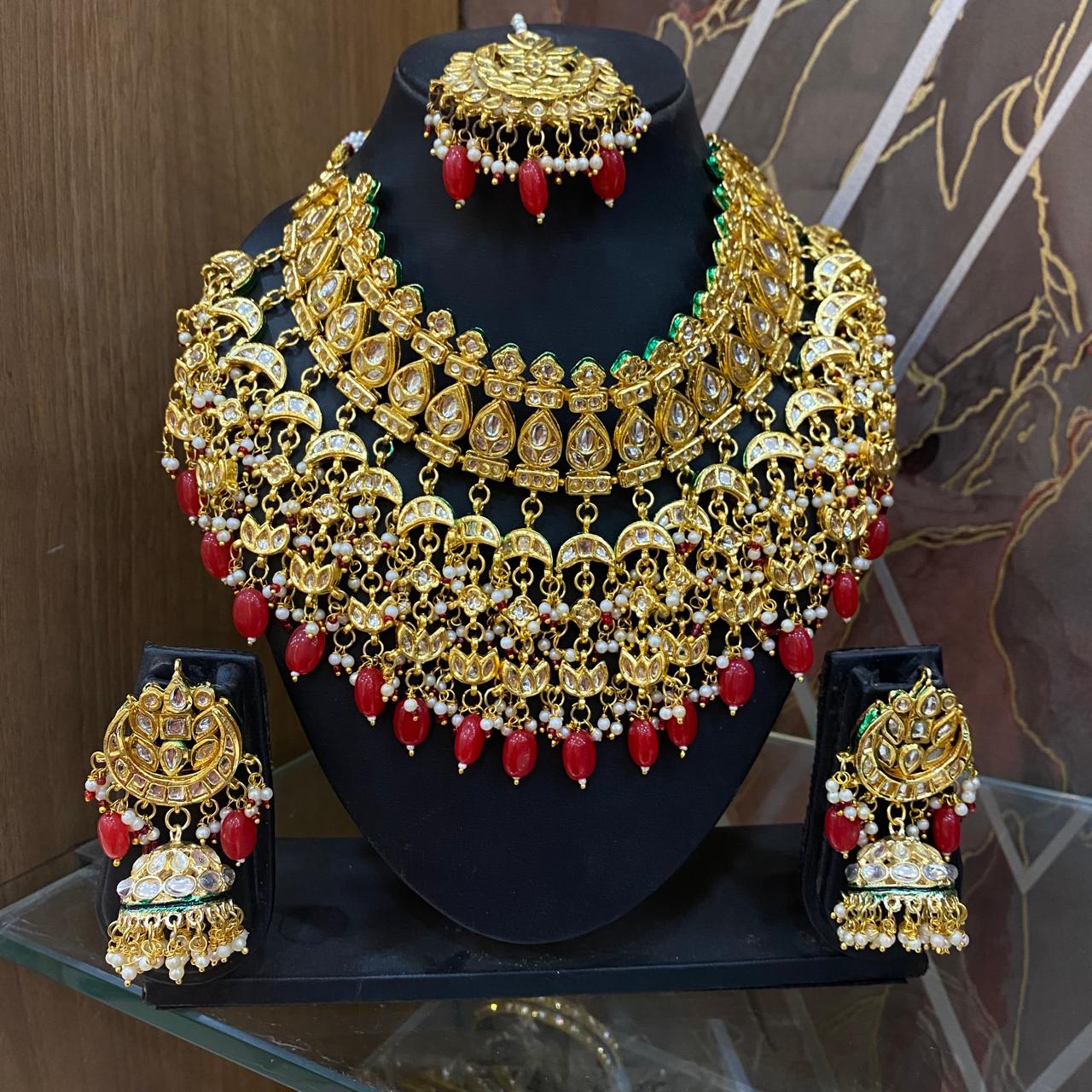 the Zevar Bridal Jewellery Set Heavy Faux Kundan Bridal Choker Set with Ruby Red Drops & Maang Tikka