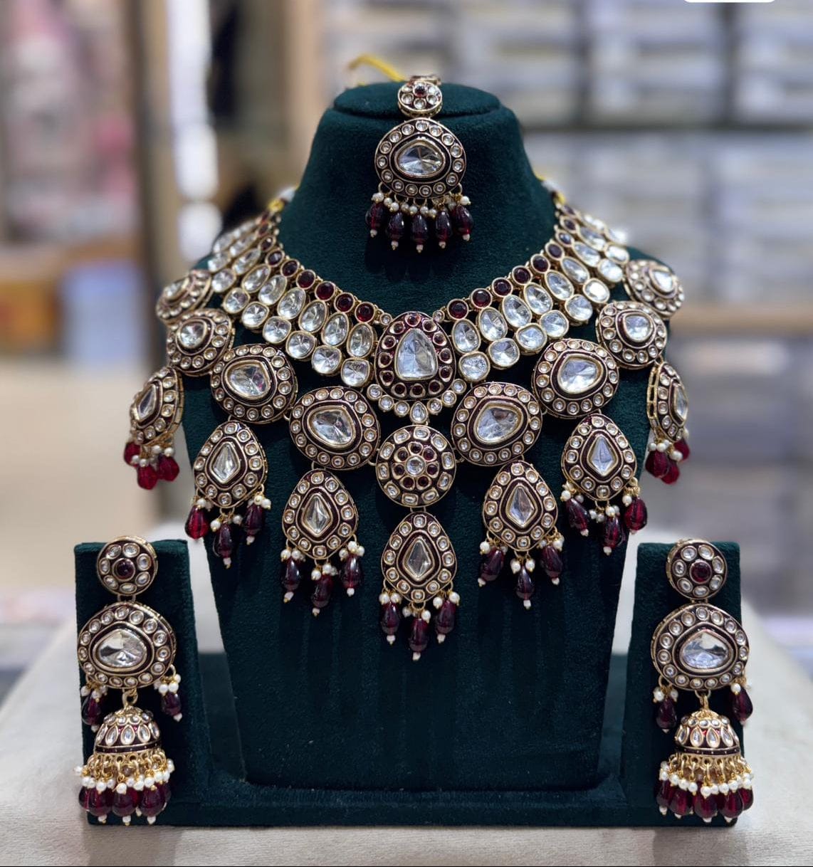 the Zevar Kundan Bridal Choker Necklace Set Maroon Royal Kundan Bridal Choker Necklace Set with Matching Jhumka & Maang Tikka