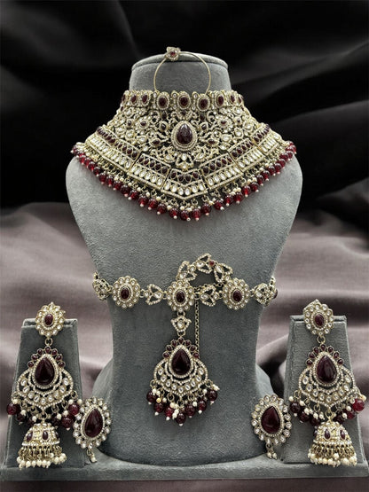 the Zevar Kundan Bridal Jewelry Set Maroon Regal Emerald Green Handcrafted Kundan Bridal Jewellery Set with Mathapatti & Nath