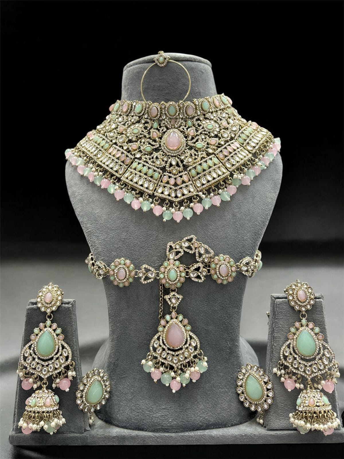 the Zevar Kundan Bridal Jewelry Set Pink & Mint Green Regal Emerald Green Handcrafted Kundan Bridal Jewellery Set with Mathapatti & Nath