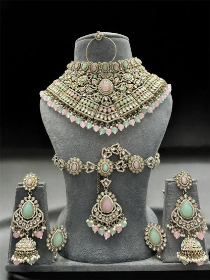 the Zevar Kundan Bridal Jewelry Set Pink & Mint Green Regal Emerald Green Handcrafted Kundan Bridal Jewellery Set with Mathapatti & Nath