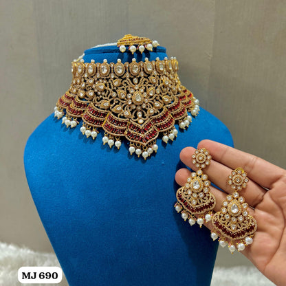the Zevar Kundan & Pearl Choker Necklace Set Maroon Royal Kundan Emerald  Ruby Pearl Bridal Choker Necklace Set with Earrings and Maang Tikka