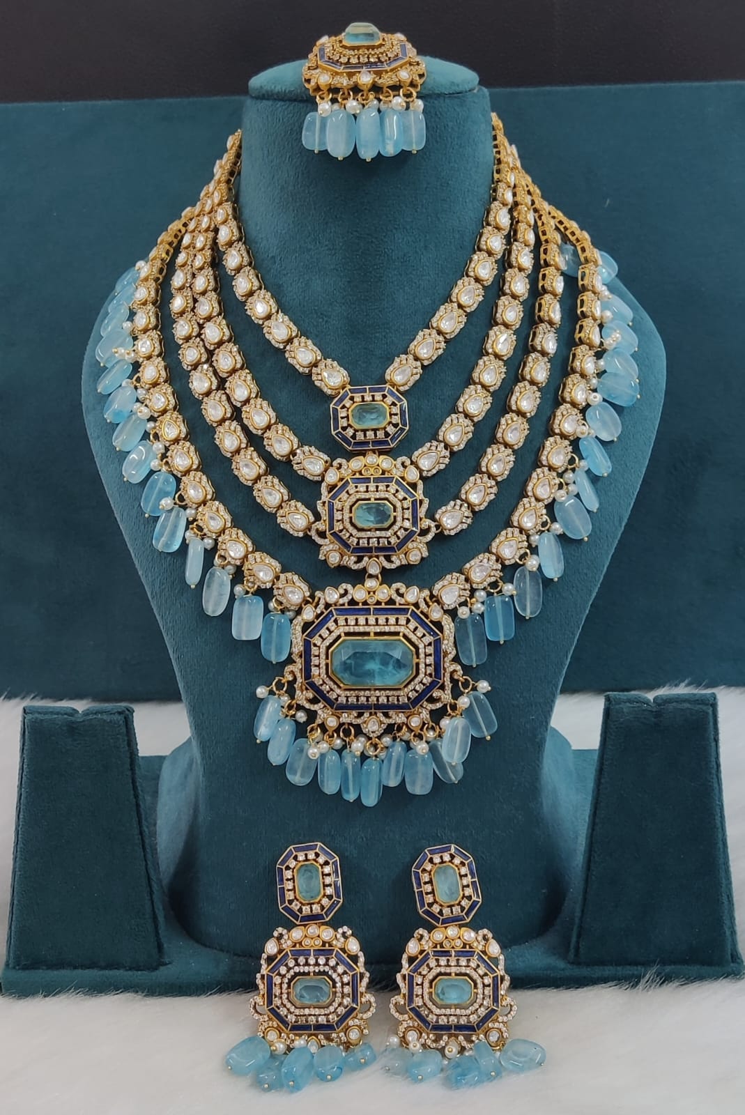the Zevar Pulki with layered Necklace Set light blue Multi-Layered Multicolor Beads Kundan Polki Necklace with Maang Tikka & Earrings
