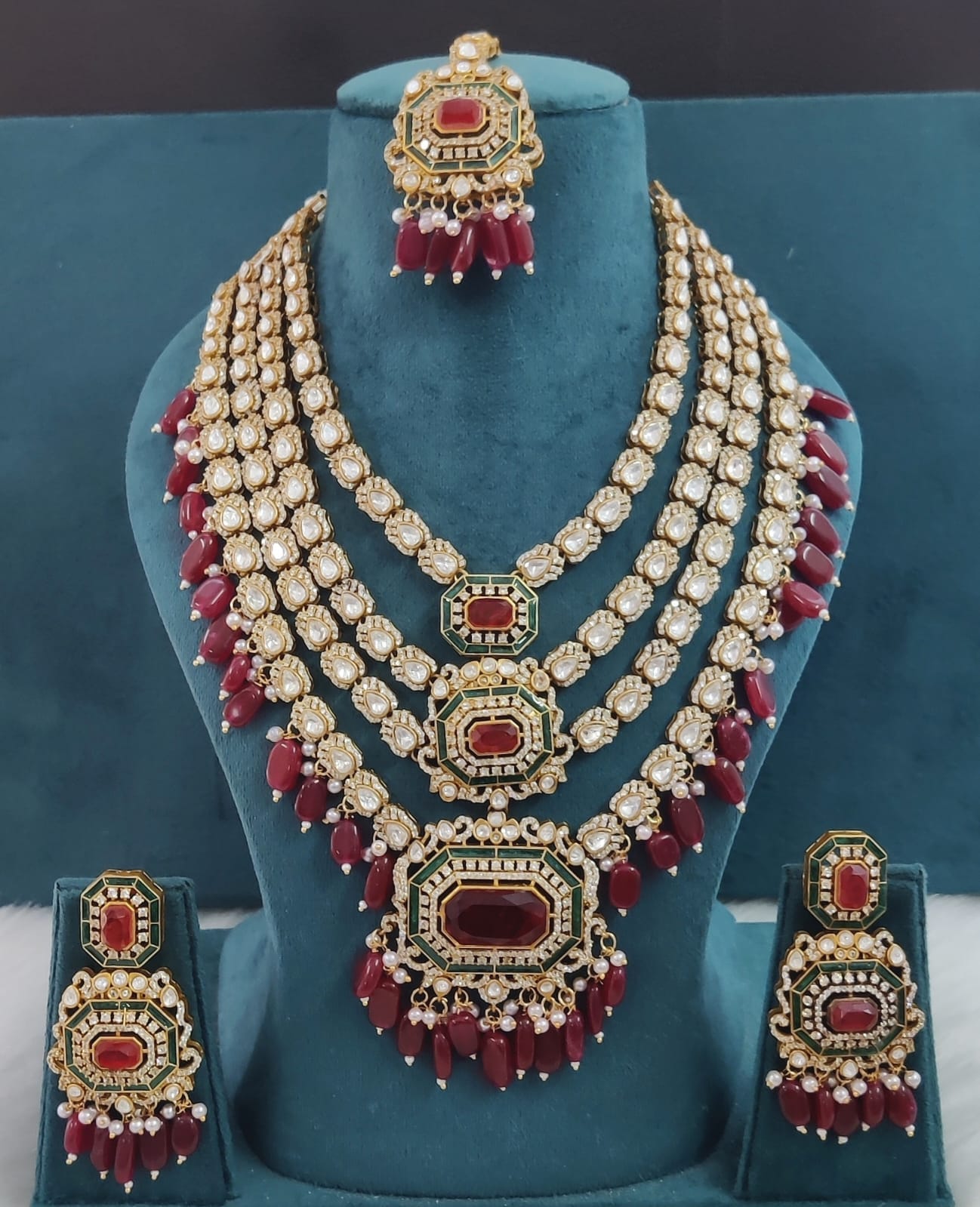 the Zevar Pulki with layered Necklace Set Maroon Multi-Layered Multicolor Beads Kundan Polki Necklace with Maang Tikka & Earrings