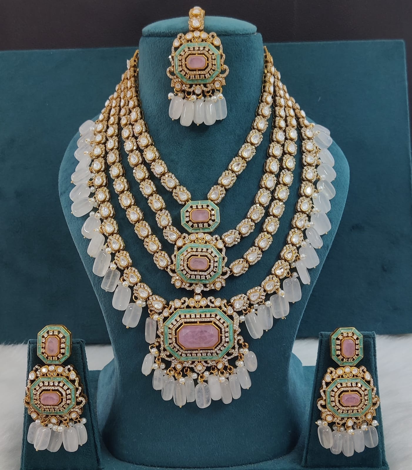 the Zevar Pulki with layered Necklace Set White Multi-Layered Multicolor Beads Kundan Polki Necklace with Maang Tikka & Earrings