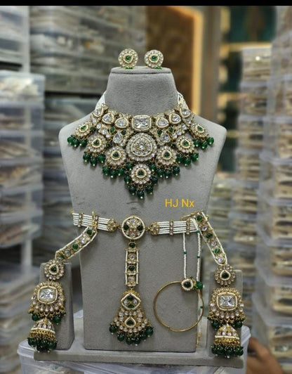 the Zevar Semi Bridal Jewelry Set Heavy Faux Kundan Semi Bridal Choker Set with Emerald Green Drops & Pearl Band Matha Patti
