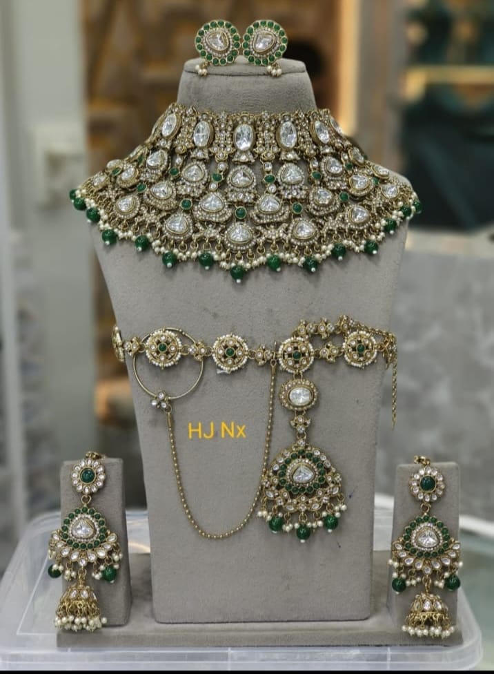 the Zevar Semi Bridal Jewelry Set Regal Radiance: Handcrafted White Kundan & Emerald Pearl Semi Bridal Jewelry Set