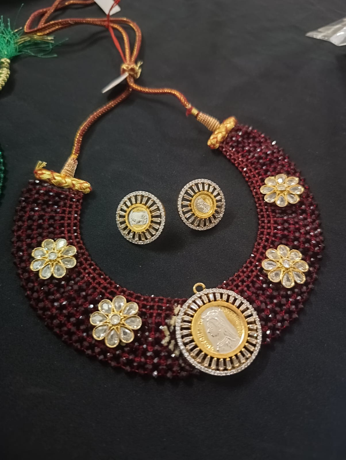 the Zevar Victorian Necklace Set Maroon Royal Victorian Maroon And Green Beaded Kundan Coin Choker Necklace Set with Matching Stud Earrings