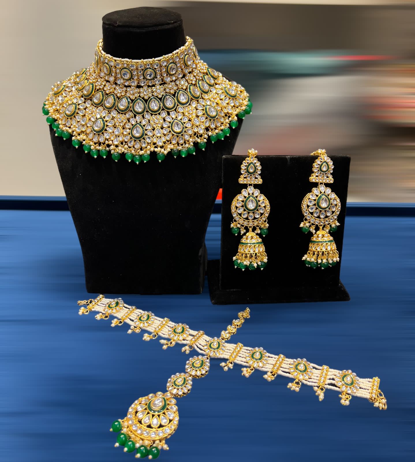 Zevar Emerald Green Kundan Bridal Set: Stunning Copper-Based Jewelry with Linear Drop Design