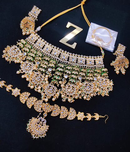 Zevar Jewelry kundan Necklace Earring With Maangtika set by Zevar